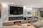 Stylish contemporary gas fireplace and large TV while admiring Sedona`s Red Rock Views